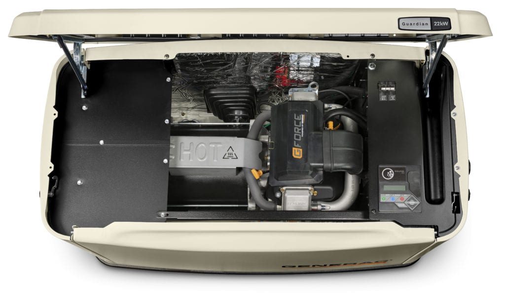 Open standby generator showing internal components and control panel