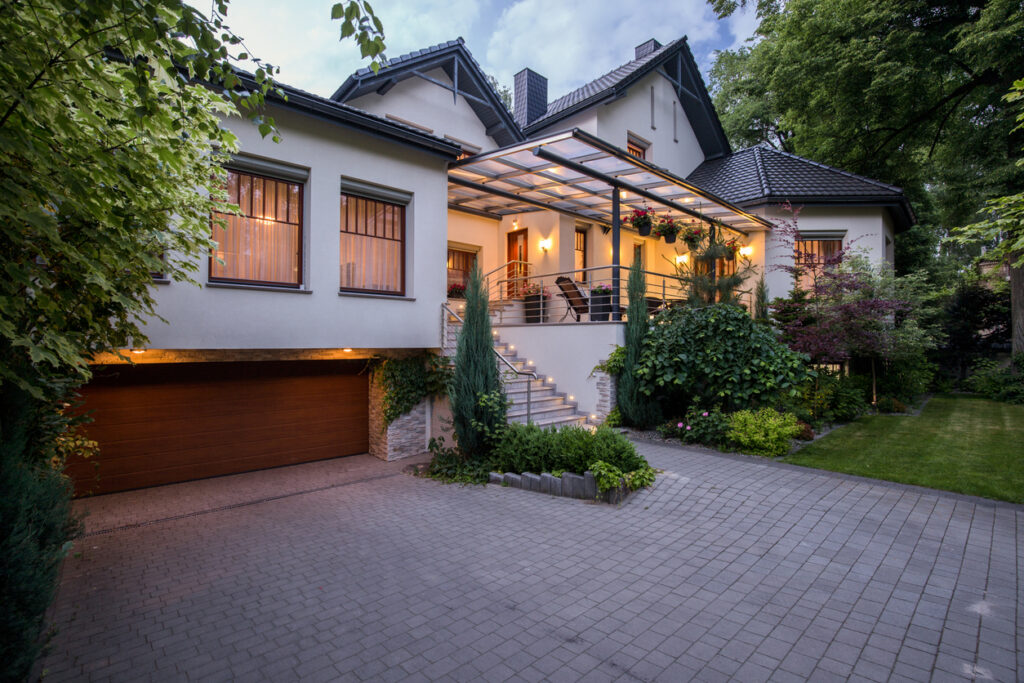 esidential home prepared for reliable backup power with outdoor lighting at dusk