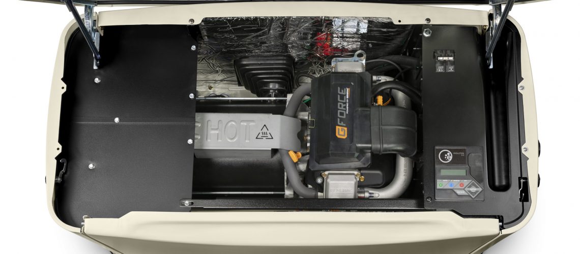 Open standby generator showing internal components and control panel