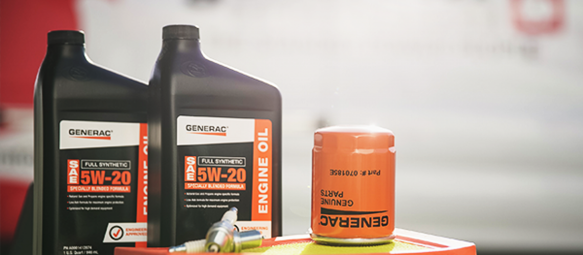 Generac generator oil, filter, and maintenance supplies on a table.